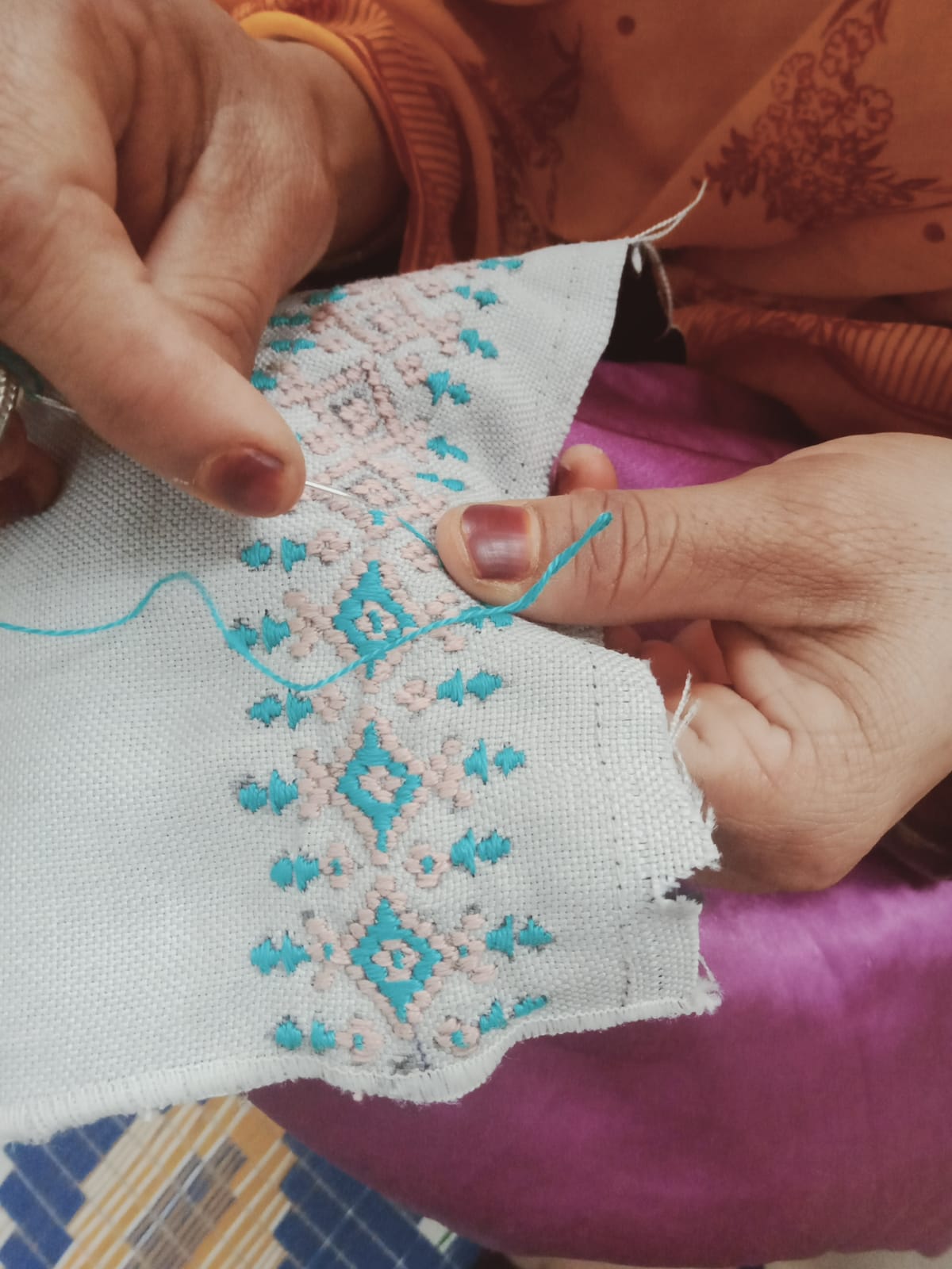 Women artisans working on embroidery